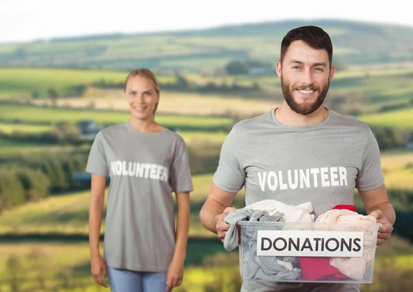 Digital composite of volunteers carrying donation boxes