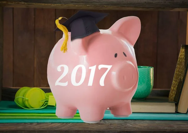 Digital composite of piggy bank with 2017