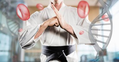 3 boyutlu DNA iplikleri ve hücrelerle dövüş sanatları yapan bir adam.