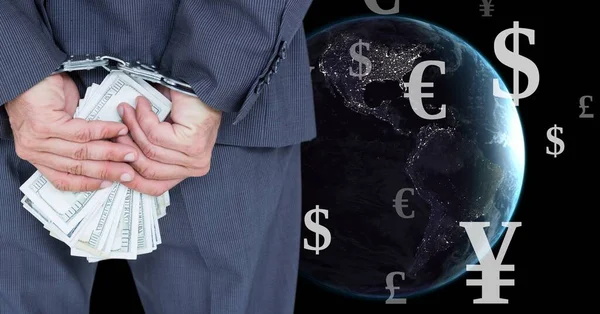 Crooked businessman with handcuffs and money over Planet earth with Mixed Currency icons
