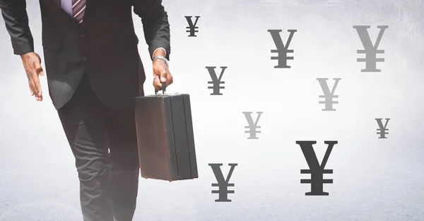 Businessman holding briefcase with Yen currency icons