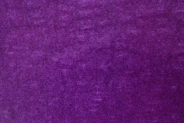 紫色の構造の紙を背景に — ストック写真