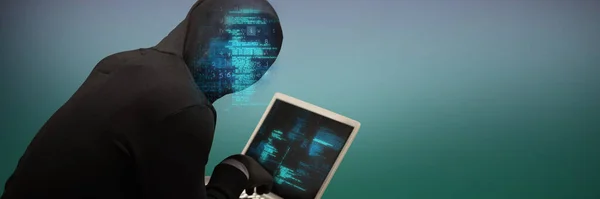 Composite image of hacker using laptop