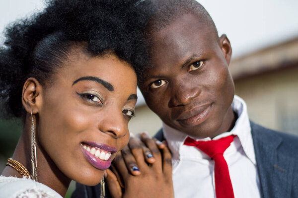 Close-up of young couple smiling at the camera