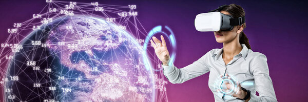 Composite image of female executive using virtual reality headset 