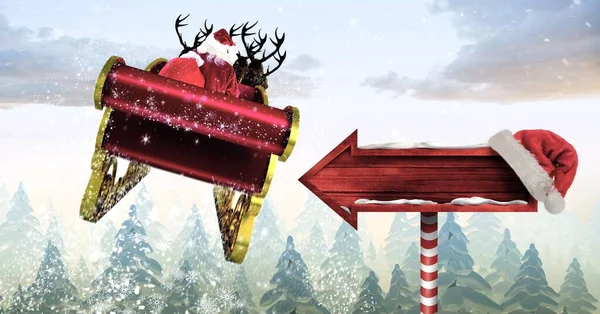 冬のトナカイ飛行とクリスマスサイン矢印と一緒に眠っているサンタ — ストック写真