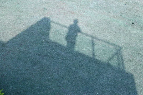 shadow of a man on the roof