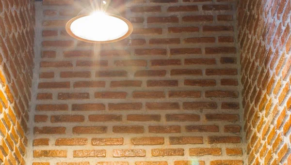 stock image light bulb on brick wall