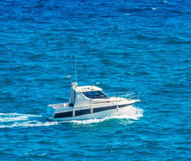 motorboat sailing on the sea, quiet cruise on the blue water