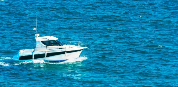 motorboat sailing on the sea, quiet cruise on the blue water