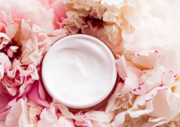 Luxe cosmetic cream jar as antiaging skincare routine product on background of peony flowers, body moisturizer and beauty branding