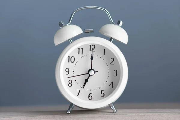 Alarm Clock Wooden Table Grey Background — Stock Photo, Image