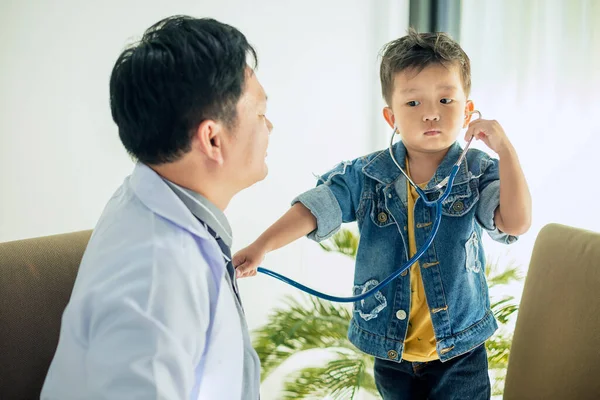 The image of a cute little boy goes to the doctor and is teasing