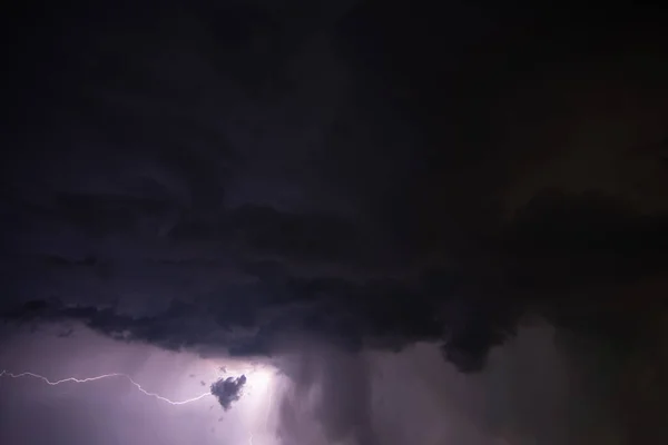 Lightning and rain clouds at night