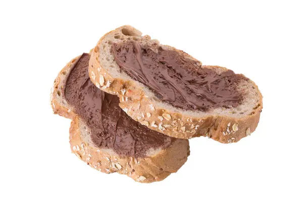 Kahverengi Buğday Ekmeğine Sürülmüş Çikolata Kremalı — Stok fotoğraf
