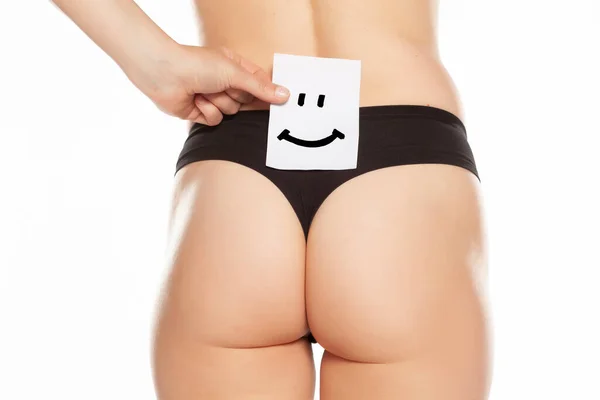 Vrouwelijke Onderkant Met Glimlach Getekend Papier — Stockfoto