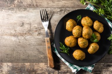 Traditional cod fritters decorated with garlic and parsley