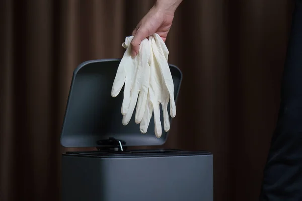 Hand Putting Used Dirty Surgical Gloves Garbage Bin — Stock Photo, Image