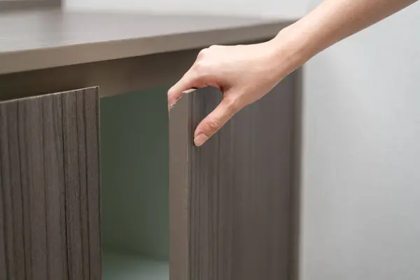 hand Open Cabinet close up