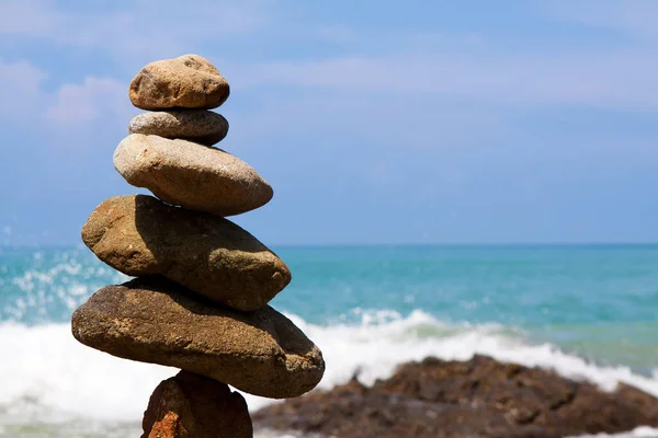 Stone zen balance on sea coast