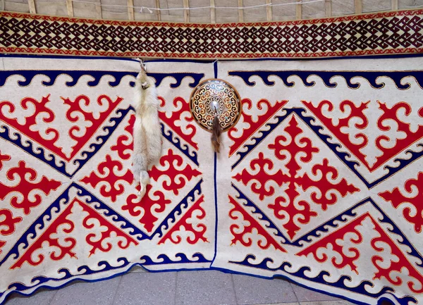 beautiful Kazakh felt carpet on background, close up