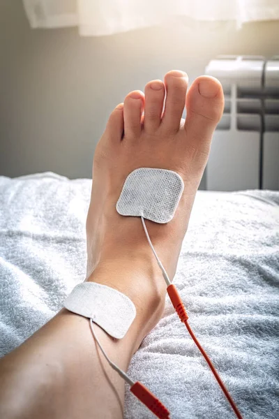 Foot on stretcher subjected to a medical treatment