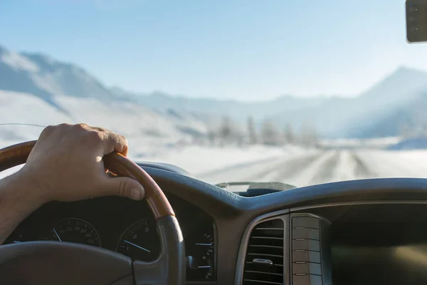 Close Man Hand Steering Wheel Car Moves Snowy Road Mountains — Stock Photo, Image