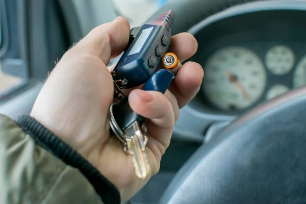Man Changes Battery Car Alarm Keychain — Stock Photo, Image