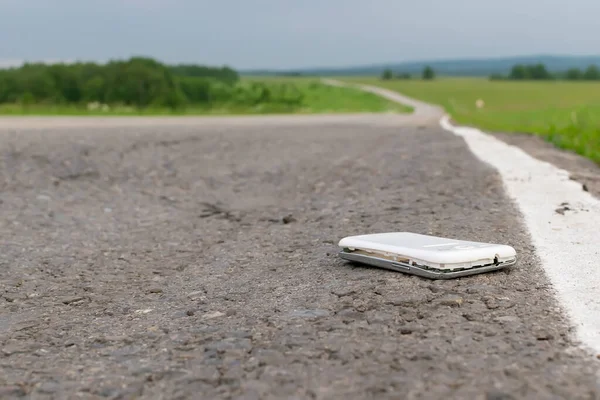 View Mobile Phone Lying Asphalt Country Road Cloudy Weather — 스톡 사진