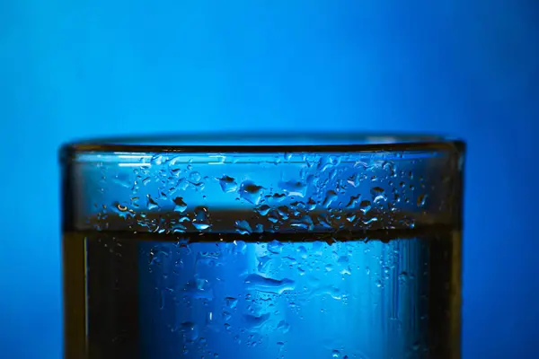 Close-up of Cool water in clear glass with steam around