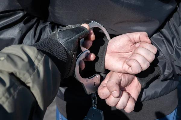 Arrest Criminal Police Officer Puts Handcuffs Hands Bandit — Stockfoto