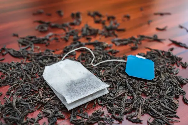 Delicious Black Loose Tea Tea Bags Lie Wooden Table — Stock Photo, Image