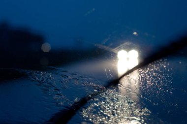 Rainy night traffic background view clipart