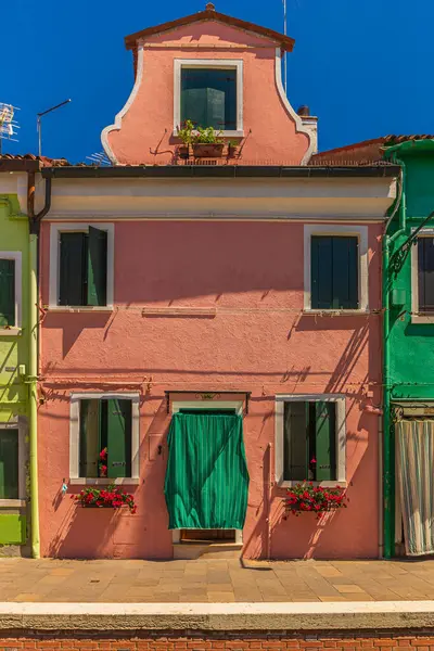 Pig skintone coloured house in Burano, Italy