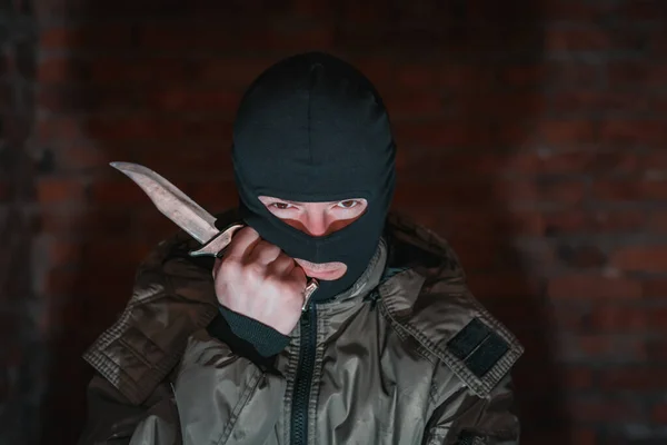 Tired Bandit Balaclava Holding Knife Brick Wall Background — Stock Photo, Image