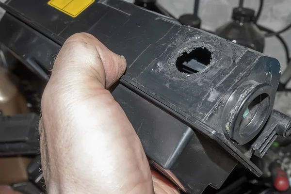 hole from poor quality disassembly of the printer toner cartridge