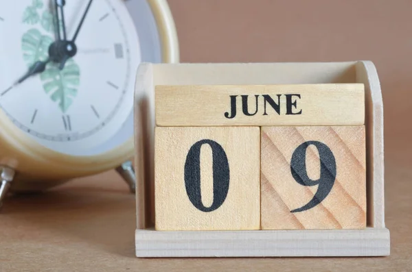 stock image wooden calendar with month of June, planning concept