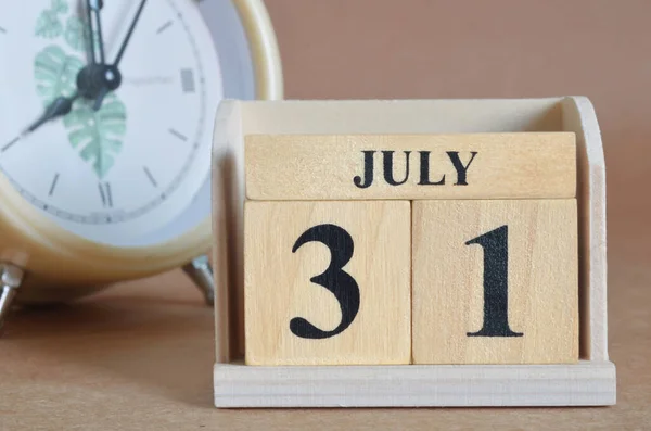 wooden calendar with month of July