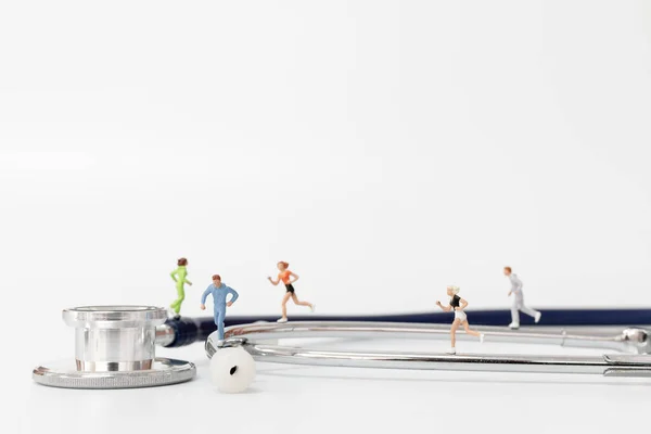 Miniature People Running Stethoscope — Stock Photo, Image