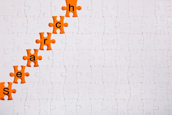 Jigsaw Puzzle Word Search Orange Background — Stock Photo, Image