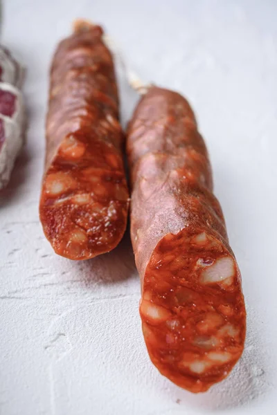 Variety Dry Cured Fuet Chorizosalami Sausages Whole Sliced White Surface — Stock Photo, Image