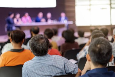 Rear view of Audience in the conference hall or seminar meeting