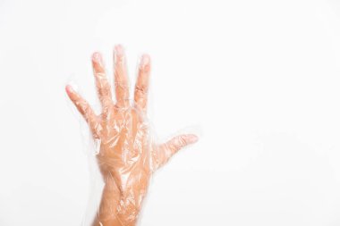 Tek kullanımlık kadın eli, tek kullanımlık şeffaf plastiği korur