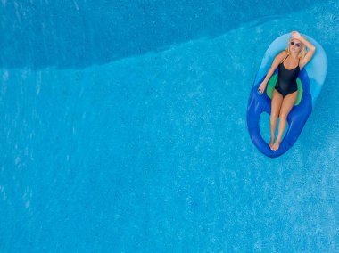 A Young Lovely Blonde Model Poses In A Bikini While Enjoying A Summers Day