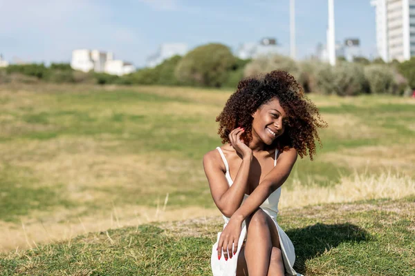 Beautiful African American Woman White Dress Sitting Grass Park Sunny — Stock Photo, Image