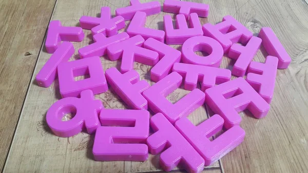 Set Plastic Alphabet Letters Placed Wooden Floor — Stock Photo, Image