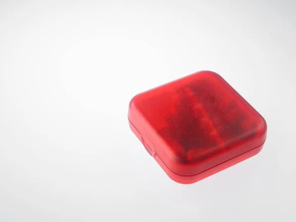 Widok Bliska Czerwone Pudełko Tabletkach Szarym Tle — Zdjęcie stockowe