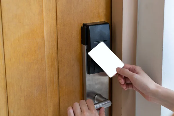 Door access control - woman hand holding white mockup key card