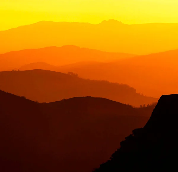 Beautiful scenery with mountains silhouettes during sunset in France