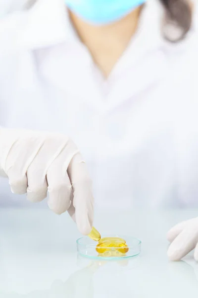 Scientist Holding Omega Capsule Lab Coat — Stock Photo, Image